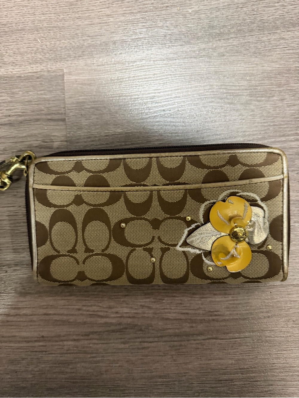 Coach Brown Signature Canvas Wristlet with Yellow Flower Detail